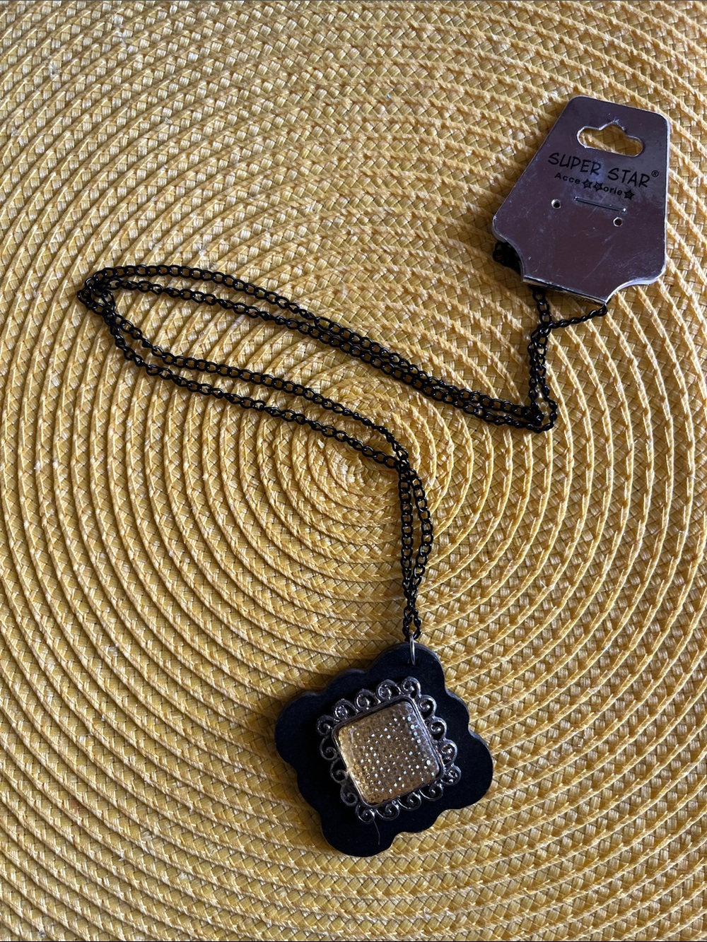 Black Pendant Necklace with Ornate Silver Accent